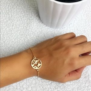 Planet earth gold bracelet